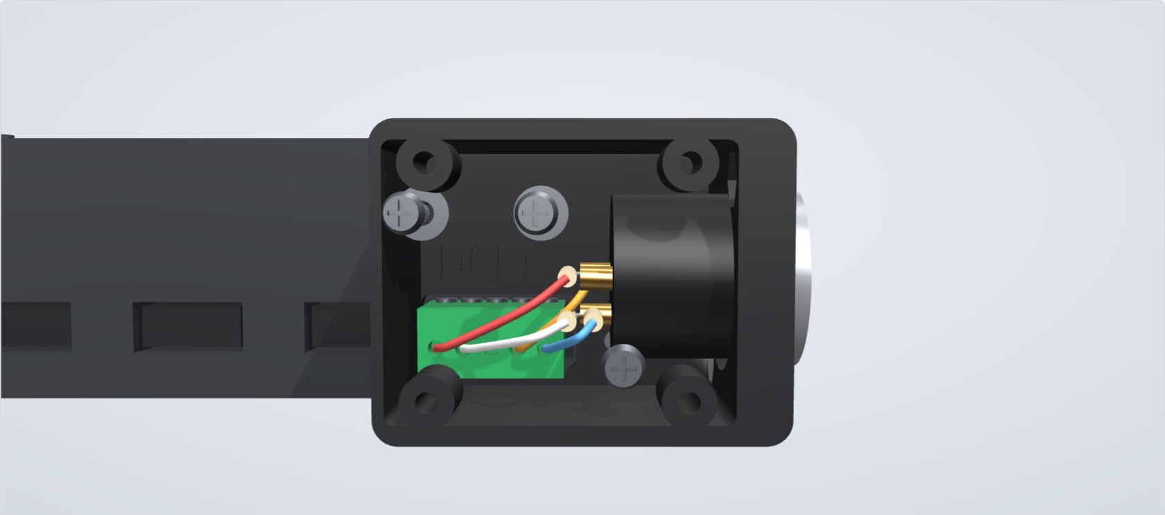 Straight-on view into the open box: the green connector, the wires to the XLR and the screw positions
