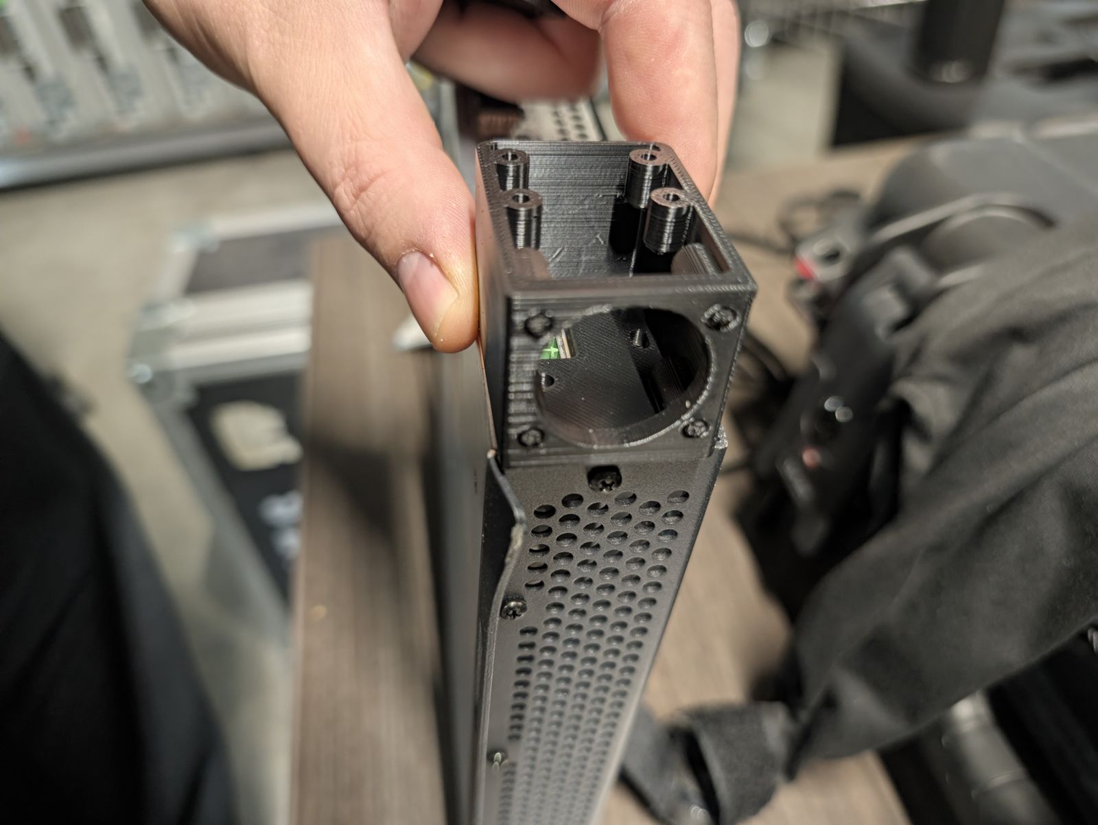 The printed box seen end-on, showing the XLR hole and the vent-hole side