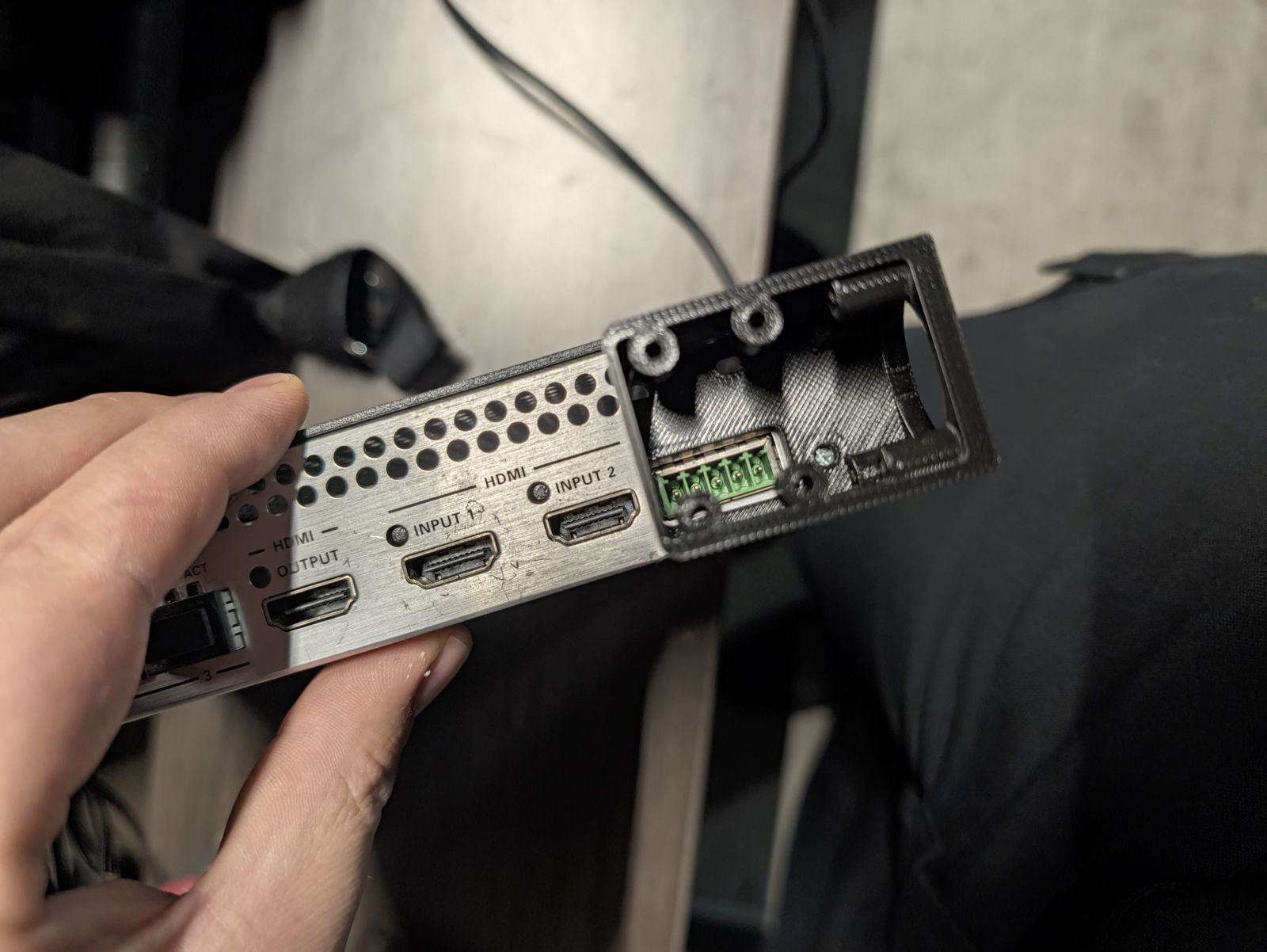 The printed box fitted on the back panel beside the HDMI inputs